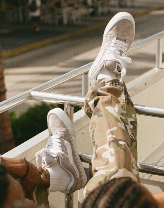 A pair of Neutral Beige Knu Skool shoes laying on the asphalt.