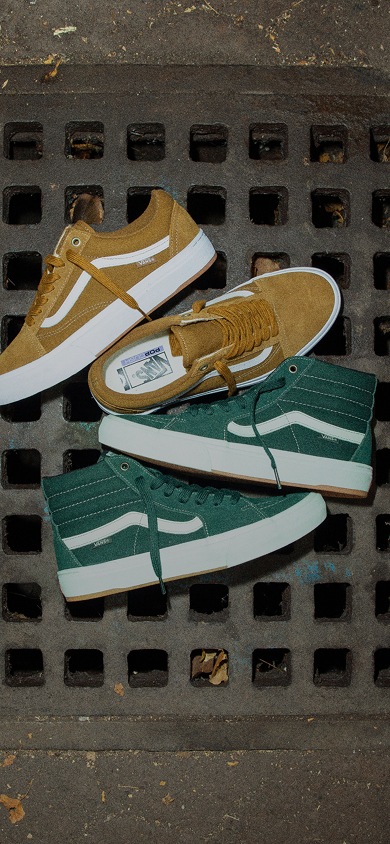 Close up shot of BMX Old Skool shoes and BMX Sk8-Hi shoes on a textured metal grate.