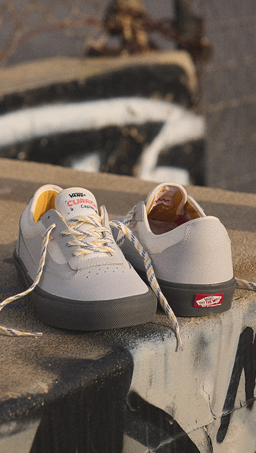 A shot of the new Vans Skate Curren in the grey colorway on a concrete step.