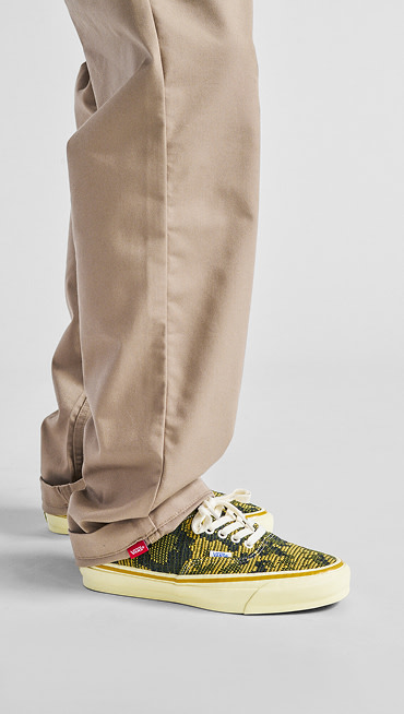 A pair of Antique Gold and Green Authentic paired with brown chinos.