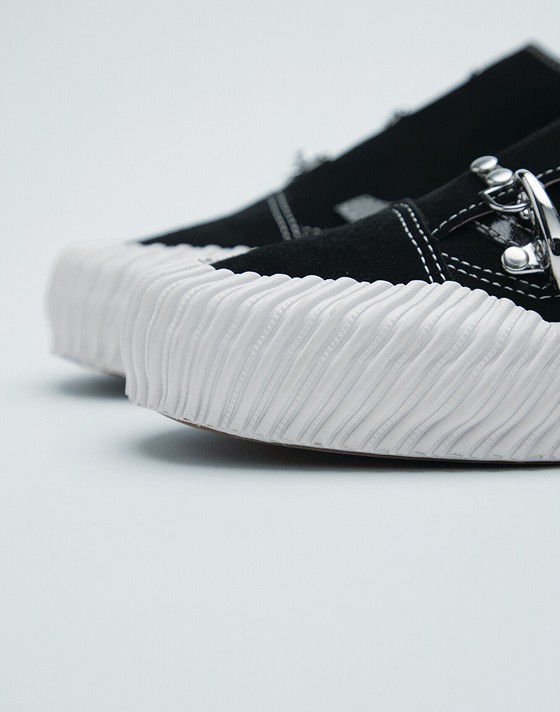 A close-up on the silver clips and embroidery on Karina Rozunuko’s Premium Old Skool from the New Future Collection.