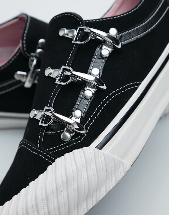 A close-up on the silver clips and embroidery on Karina Rozunuko’s Premium Old Skool from the New Future Collection.