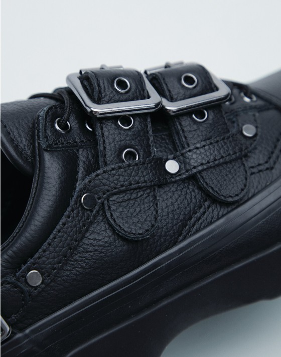 A close-up on the leather straps and silver buckles on Efron Danzig’s Premium Old Skool from the New Future Collection.