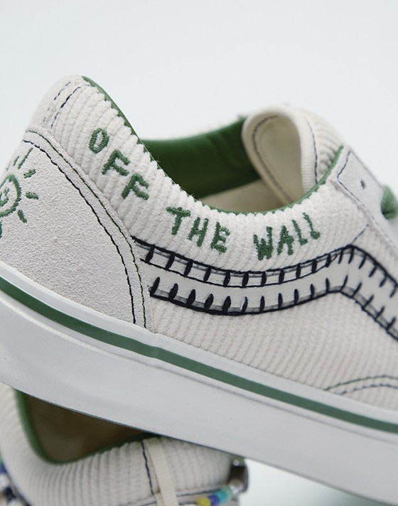 A close-up of a stitched Off the Wall phrase on the sidewall of Cocona Hiraki’s white and green Premium Old Skool.