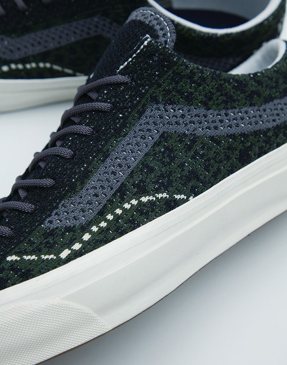 A close-up of the knitted texture on the Cheetah Dried Kelp Green Premium Old Skool.