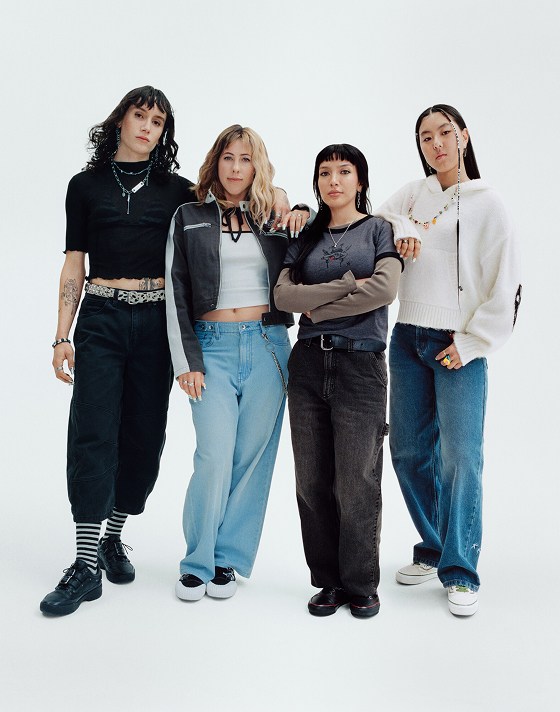 Vans athletes Efron Danzig, Karina Rozunko, Tania Cruz, and Cocona Hiraki pose together in a photography studio.