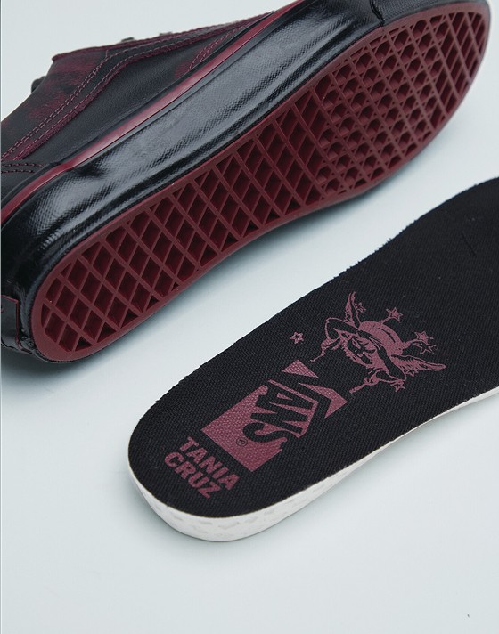 Details of the pattern on the red outsole and the illustration on a removed insole from Tania Cruz’s Premium Old Skool.
