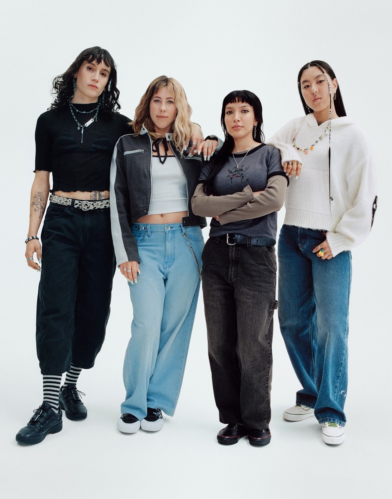 Vans athletes Efron Danzig, Karina Rozunko, Tania Cruz, and Cocona Hiraki pose together in a photography studio.