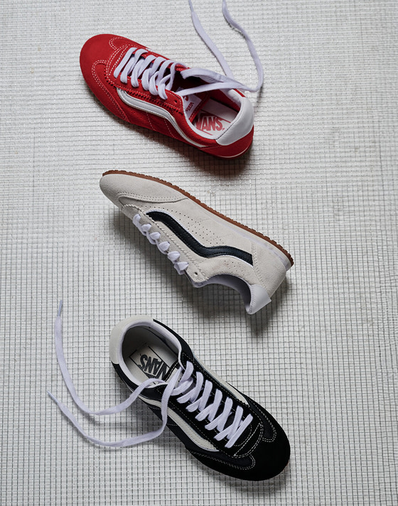 A Racing Red, a Marshmallow White, and a black Super Lowpro laid out on a grate.