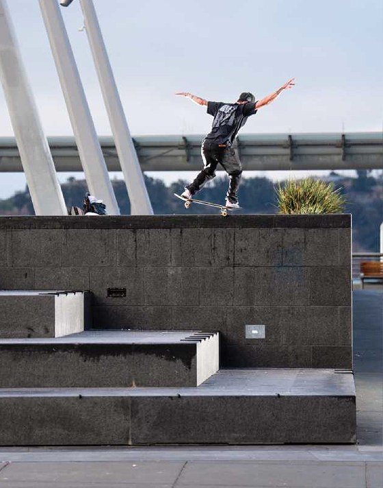 Vans Skate Team Rider Kyle Walker nosesliding on a concrete ledge in the Kyle Walker Wafflecup skate shoes.