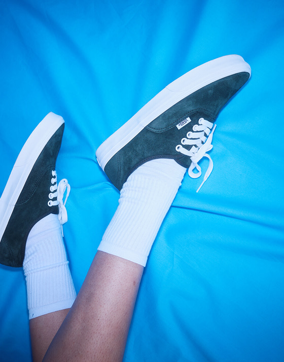 A close-up of the green pig suede Authentic on a blue tarp on the set of Open Set Los Angeles.