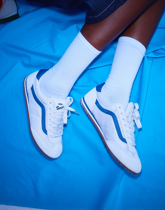 A close-up of musician Vanessa wearing white Super Lowpro on the set of Open Set Los Angeles.