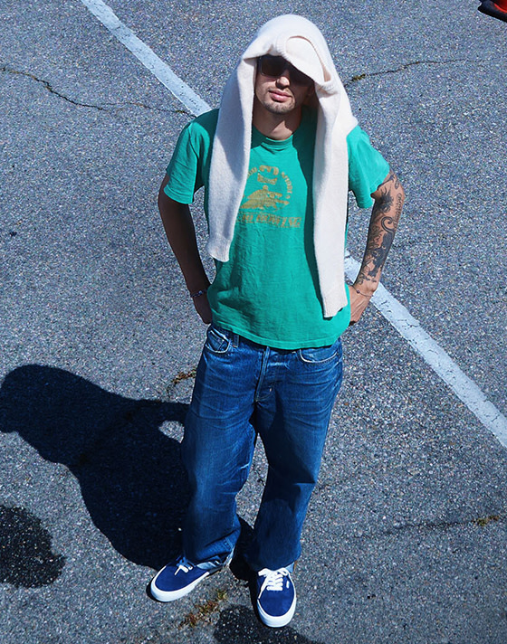 An overhead shot of designer Pablo wearing blue pig suede Authentic in a parking lot on the set of Open Set Los Angeles.