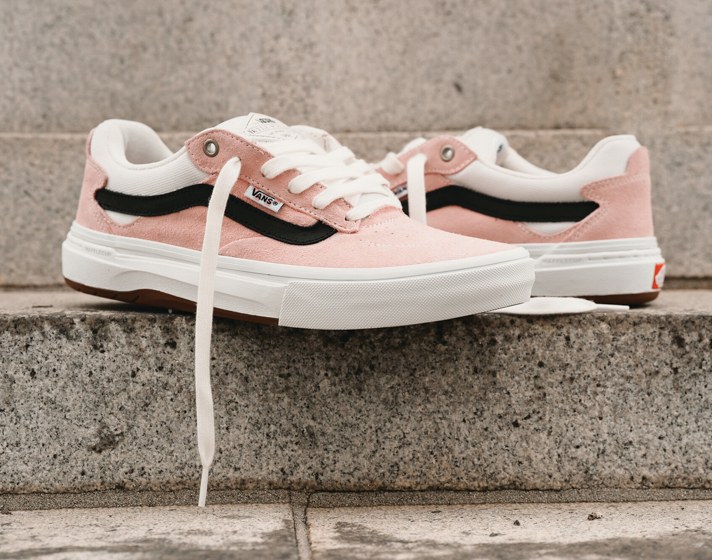 Kyle Walker Wafflecup shoes placed on a stone step.