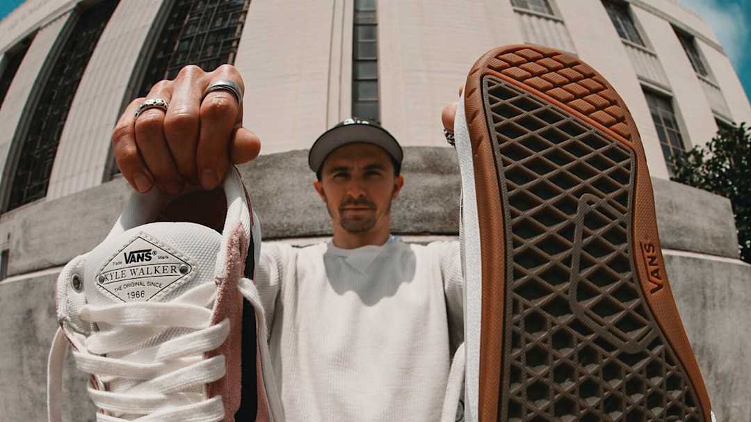 Kyle Walker holds up his Kyle Walker WaffleCup signature skate shoe. 