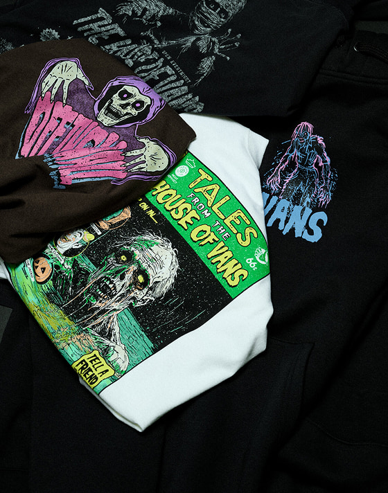 A selection of Vans Halloween t-shirts stacked on top of each other.