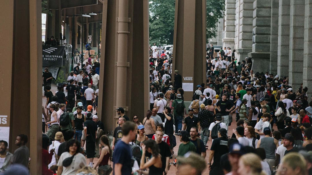 A landscape photo of the Brooklyn Banks in New York, showing a huge crowd for Go Skate Day 2025.