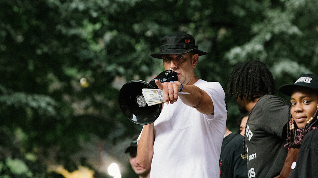 Gotham Park’s Steve Rodriguez handing out cash to skaters at Go Skate Day.