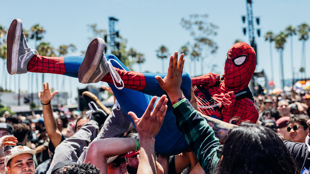 Someone in a Spider-Man suit wearing Vans crowdsurfing at Warped Tour 2025.