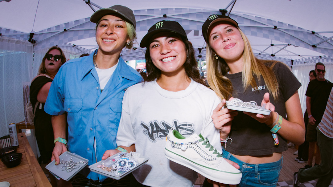 Vans athlete holding their customized Vans shoes in the Vans Charm Pit at Warped Tour Long Beach 2025.