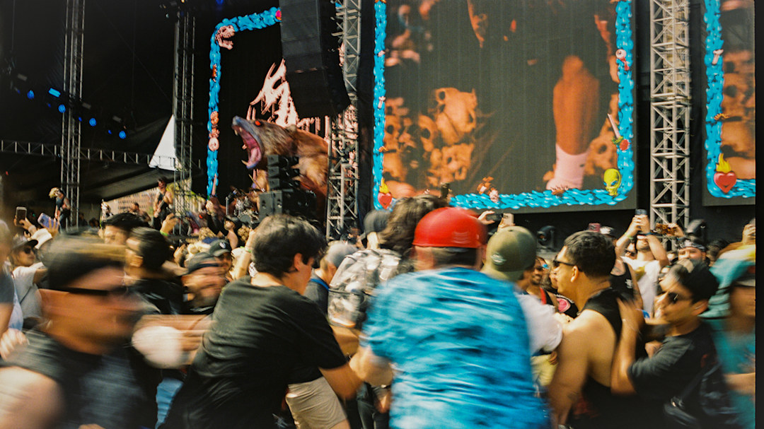 A mosh pit at Warped Tour while Slaughter to Prevail plays.
