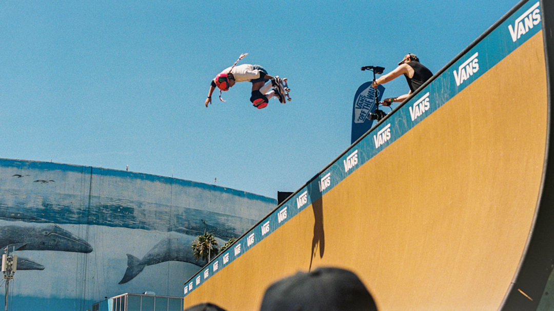 Cocona Hiraki doing an air at the Vans vert ramp at Warped Tour 2025.