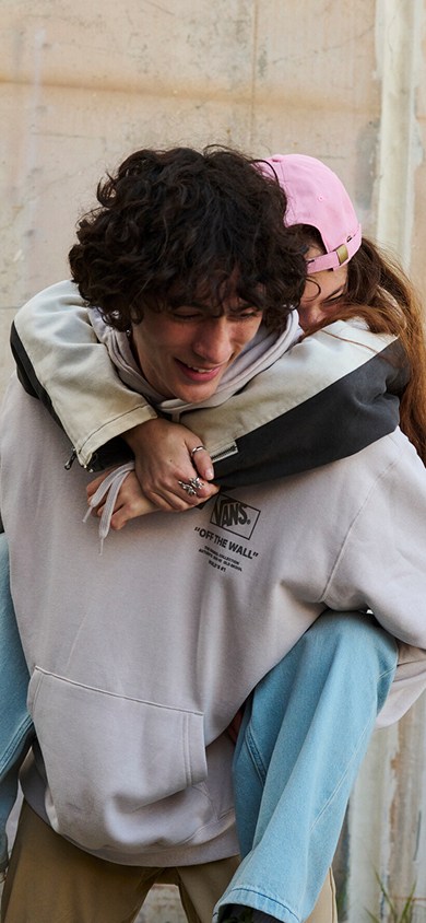 Two images: one of a boy and girl in Vans fall layers and the other of a woman posing in a warehouse wearing a MTE Hillgate Puffer with silver jewelry.