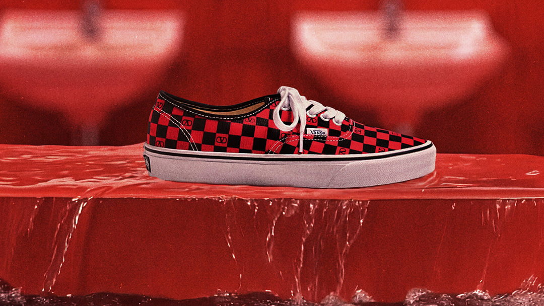Valentino and Vans Authentic sitting on a flooded floor.