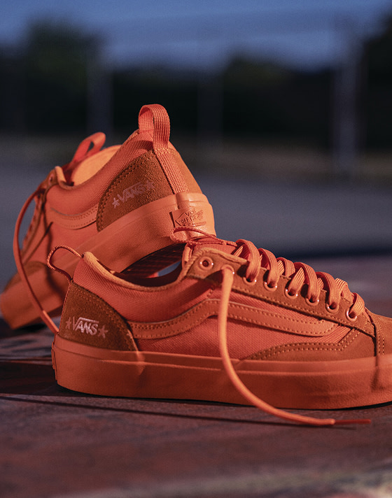 The orange Skate Old Skool 36+ lies on a playground from the United Through Skateboarding collection.