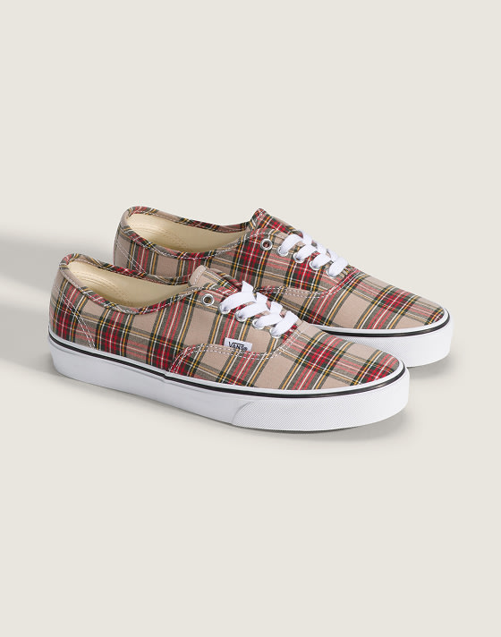 A pair of red and brown plaid Authentic in a photography studio.