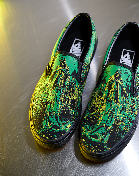 An overhead shot of the spooky green and yellow Halloween graphic on the Classic Slip-On as part of the Vans Halloween collection.