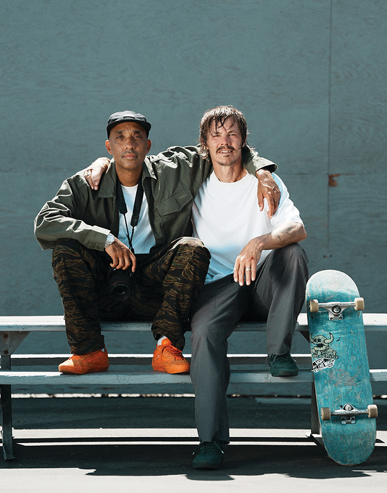 Atiba Jefferson and Vans Skate Team Rider pose for a photo together on a playground in the United Through Skateboarding Collection.