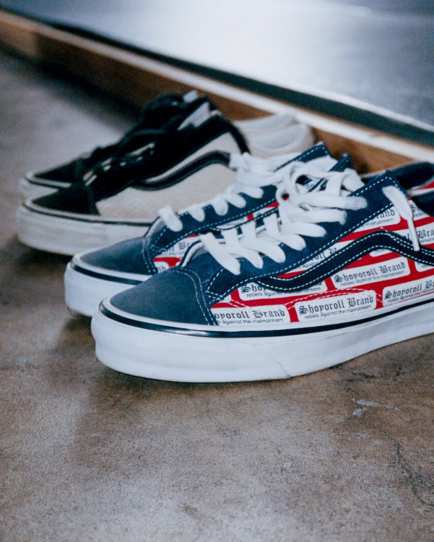 Vans X Shoyoroll shoes on the ground next to the BJJ mat.
