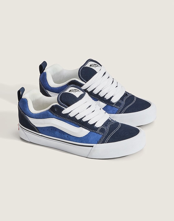 A pair of black and navy Knu Skool in a photography studio.