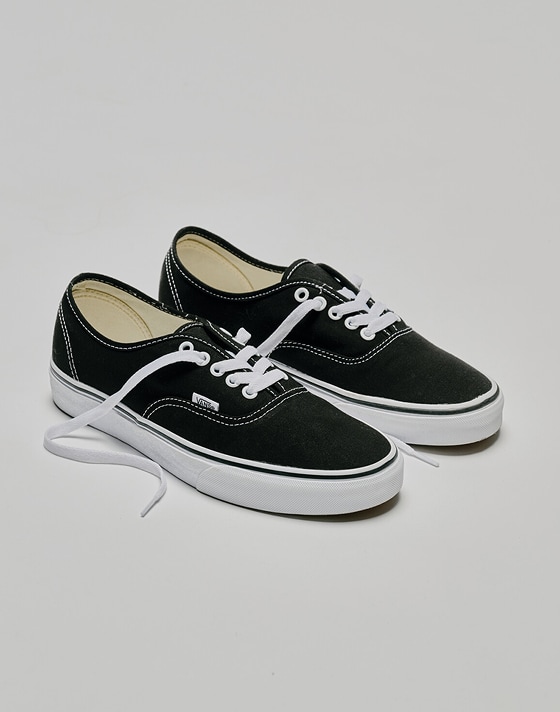 A pair of black and white Authentic in a photography studio.
