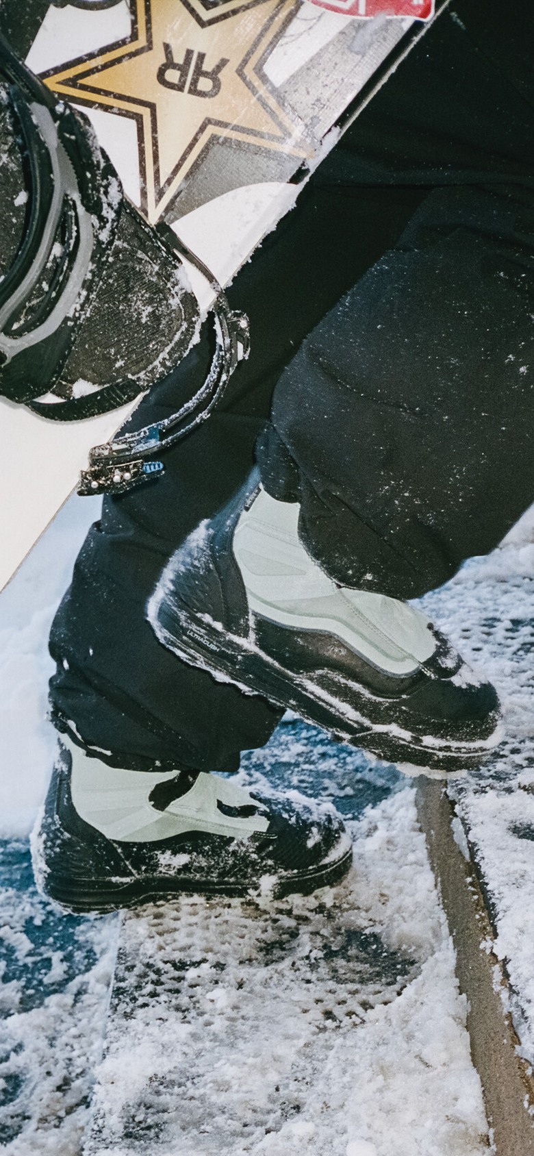 Vans Snow Team Rider Parker Szumowski trudges through the snow in the High Country 3L Outerwear and the Infuse snowboarding boots.