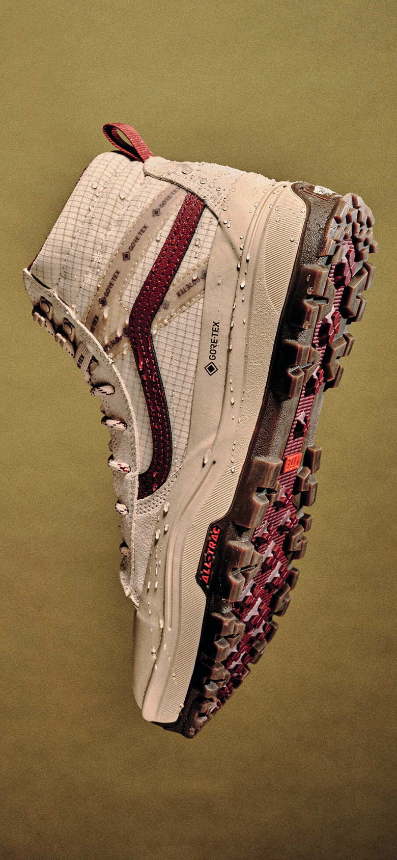 A white and red Sk8-Hi GORE-TEX floating in mid-air with moisture beads on the GORE-TEX exterior.