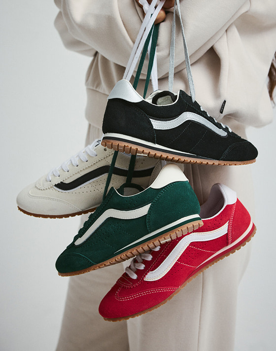 Someone holds many pairs and colors of the Super Lowpro.