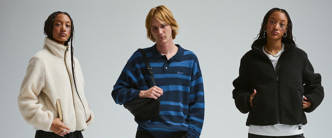 A young man and young woman in fall layers and styles.