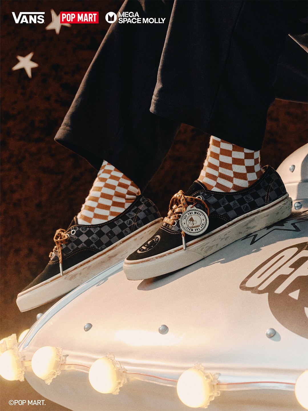 Vans × Space Molly black checkerboard sneakers with tan soles and rope laces.