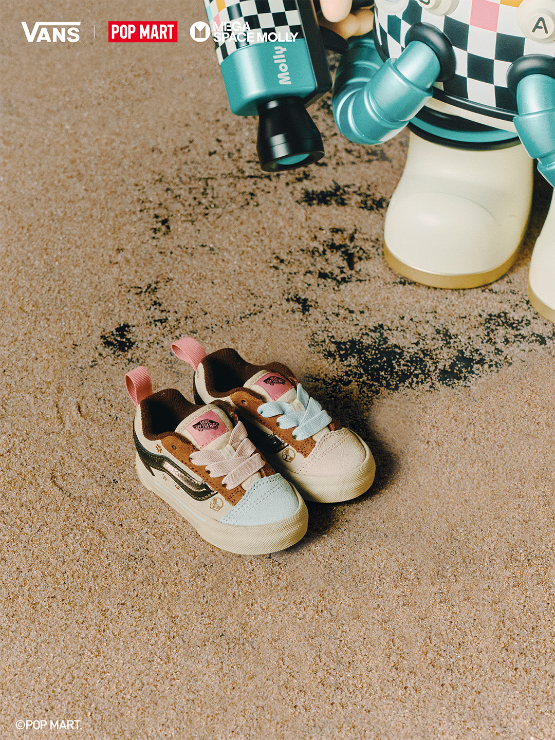 Vans × Space Molly toddler shoes with pastel laces beside Space Molly figure.