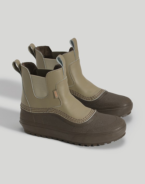 Close-up of the bay leaf green Standard Mid Chelsea Waterproof Boot in a photography studio.