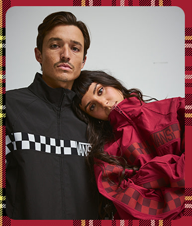 A photograph surrounded by a plaid holiday border of a man and woman posing in the Ronnie Track Jacket.