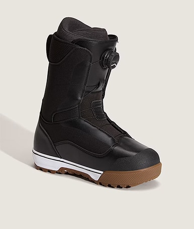 A pair of black, white and gum Women's Encore Pro Snowboard Boot in a photography studio.