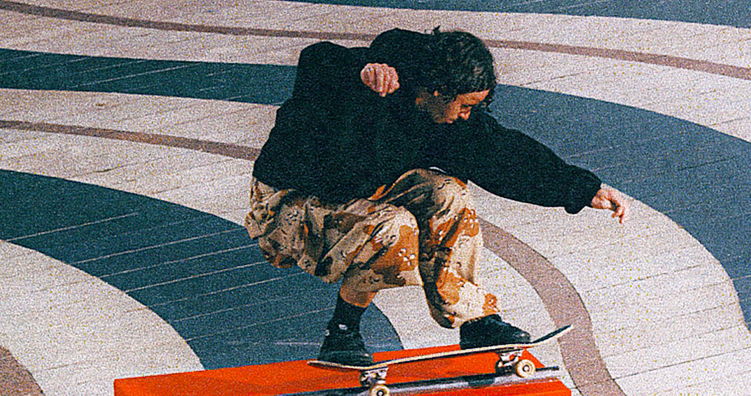 A skater sliding a rail while wearing the OTW by Vans X OAMC X WTAPS shoes.