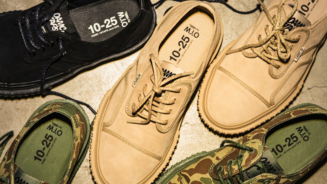 An assortment of OTW by Vans X OAMC X WTAPS shoes on the floor.