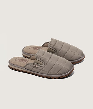 A pair of taupe gray Quilted Mountain Mules in a photography studio.