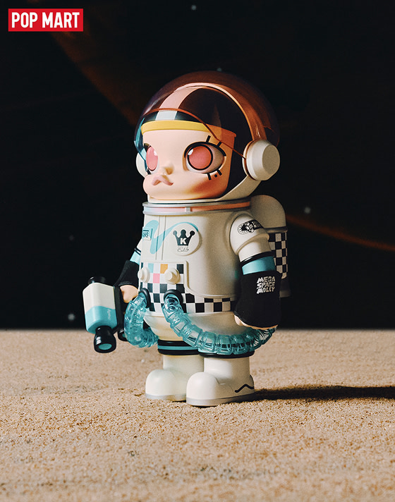 Space Molly sits in her UFO starship with light reflecting off the cockpit while a panel reads Space Molly.