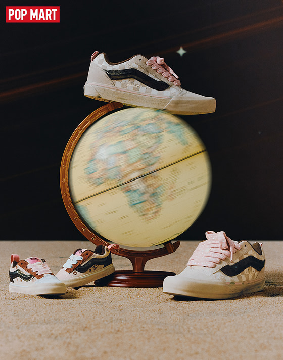 Several sizes of the Vans and Space Molly collaboration Knu Skool sit around a spinning globe on the set of a space-themed shoot.
