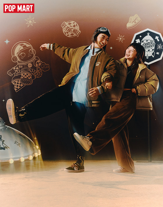 A young man and woman walk with linked arms wearing the adults’ Vans x Space Molly Authentic on the set of a space-themed shoot.